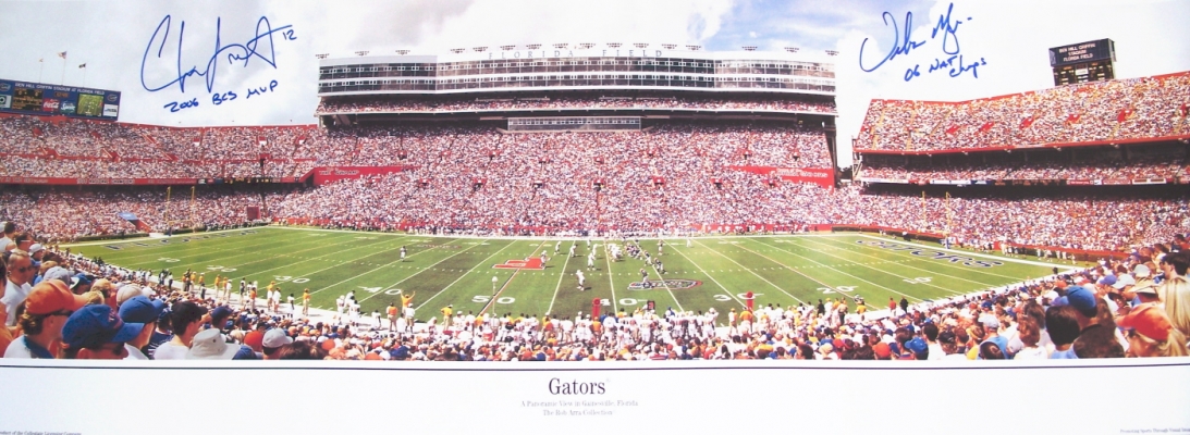 Chris Leak AND Urban Meyer Dual Autographed Florida Gators 13x39 Panoramic Photo with "2006 BCS MVP" AND "06 NAT CHAMPS" inscriptions
2006 National Championship Quarterback Chris Leak AND Coach Urban Meyer have both personally hand signed Florida Gators Panoramic 13.5 x 39 inch photo with Blue sharpie pens.  Chris added his "2006 BCS MVP" inscription below his signature, which was signed on March 9, 2007.  Coach Meyer added his "06 NAT CHAMPS" inscription below his signature, which was signed on March 14, 2007, in Gainesville, FL.  This item comes with The REAL DEAL Memorabilia deluxe Authenticity, you will receive 1. Two large photos of Chris and Urban signing your type of item, 2. a detailed Certificate of Authenticity, and 3.  Matching REAL DEAL Authenticity Holograms on all items! 
Keywords: CLUMPGators