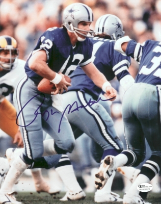 Roger Staubach Autographed Dallas Cowboys 8x10 "Hand Off" Photo
Roger Staubach has personally hand signed this 8x10 Photo with a Blue sharpie pen.   This item comes with a numbered Online Authentics.com authenticity sticker on the autographed photo, which you can verify online once you purchase it at Online Authentics.com, which is one of the top third party authenticators in the memorabilia industry.  This item also comes with a REAL DEAL Memorabilia Certificate of Authenticity (COA).  Get The REAL DEAL.

Keywords: RS8x10handoff