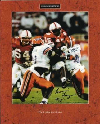 Tommie Frazier Signed Nebraska 8x10 Photo
The 1995 Nebraska Cornhuskers led by Tommie Frazier became back-to-back National Champs since the 1970's. Frazier had a 33-3 record as the Huskers QB. Tommie has autographed this 8x10 Photo.  Comes with an Authenticity Hologram and Certificate of Authenticity from The Real Deal Memorabilia.

Keywords: TF8X10
