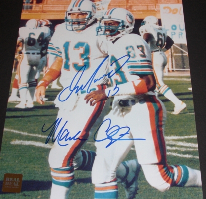 Dan Marino and Mark Clayton DUAL Autographed Miami Dolphins 8x10 Photo
Dan Marino AND Mark Clayton have  personally hand signed this Miami Dolphins 8x10 Photo with Blue sharpie pens.  This item comes with a REAL DEAL Memorabilia Certificate of Authenticity (COA) and a Real Deal Hologram on the Photo.  Get The REAL DEAL!

Keywords: DMMC8x10