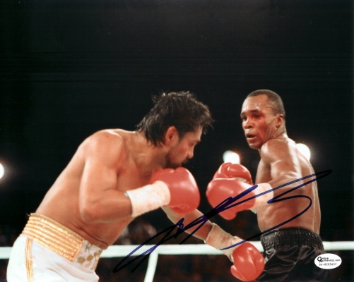 Suger Ray Leonard Autographed 8x10 Action Photo
Suger Ray Leonard has personally hand signed this 8x10 Photo with a Blue sharpie pen.   This item comes with a numbered Online Authentics.com authenticity sticker on the autographed photo, which you can verify online once you purchase it at Online Authentics.com, which is one of the top third party authenticators in the memorabilia industry.  This item also comes with a REAL DEAL Memorabilia Certificate of Authenticity (COA).  Get The REAL DEAL.

Keywords: SRL8x10