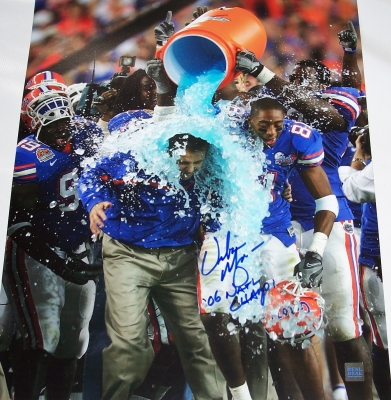 2006 National Championship Coach Urban Meyer has personally hand signed this "Gatorade Dunk" 16x20 photo with a blue sharpie pen.  Coach Meyer added his "06 NAT CHAMPS" inscription below his signature, which was signed on March 14, 200
2006 National Championship Coach Urban Meyer has personally hand signed this "Gatorade Dunk" 16x20 photo with a blue sharpie pen.  Coach Meyer added his "06 NAT CHAMPS" inscription below his signature, which was signed on March 14, 2007, in Gainesville, FL.  This item comes with The REAL DEAL Memorabilia deluxe Authenticity, you will receive 1. A large photo of Urban signing, 2. a detailed Certificate of Authenticity, and 3.  Matching REAL DEAL Authenticity Holograms on all items!
Keywords: UM16x20Gatorade